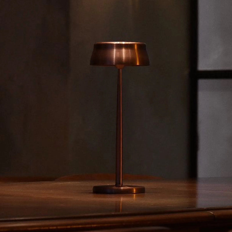Wireless Metal Modern Table Lamp in bronze finish on dark table | luxury cordless LED table lamp | Zafferano Sister
