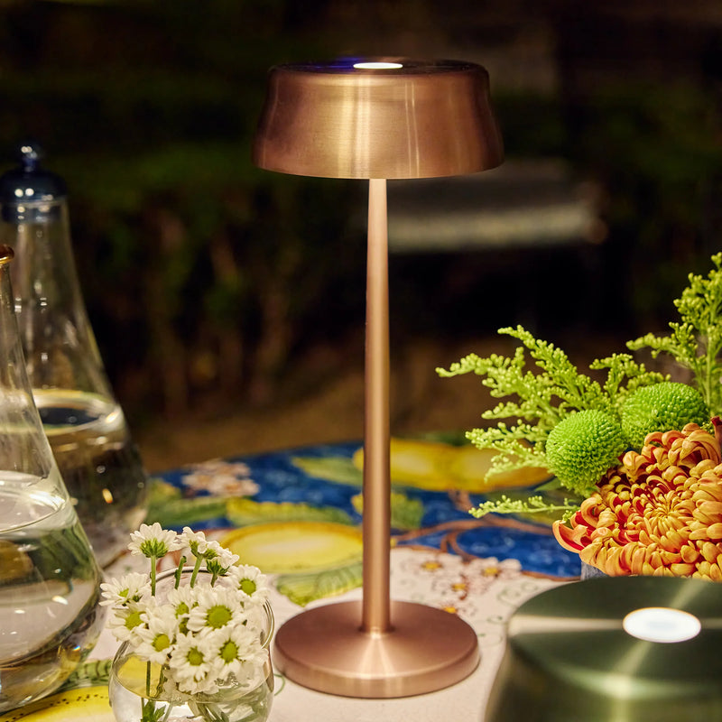 Wireless Metal Modern Table Lamp in bronze finish on garden table | cordless LED table light for outdoor dining | Zafferano Sister