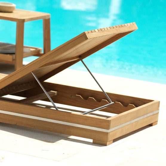 Close-up of teak reclining sun lounger with sturdy stainless steel frame | Luxury outdoor sunbed with multiple reclining positions | Perfect for modern poolside and garden settings | Ethimo Essenza