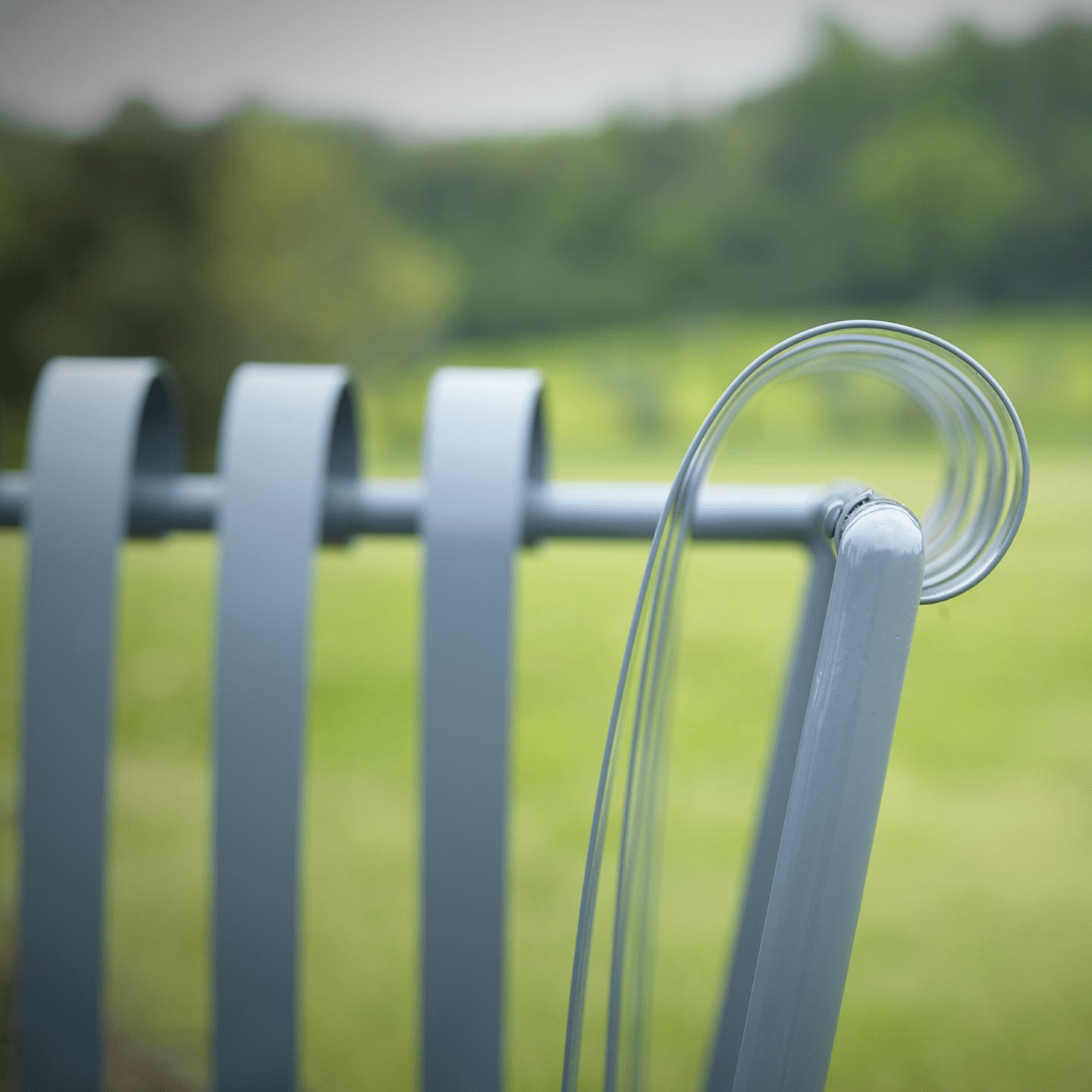 Contemporary Patio Chair with Curved Steel Strips | Officina Ciani MOLLE Collection | Elegant Outdoor Metal Seating | Luxury Italian Design