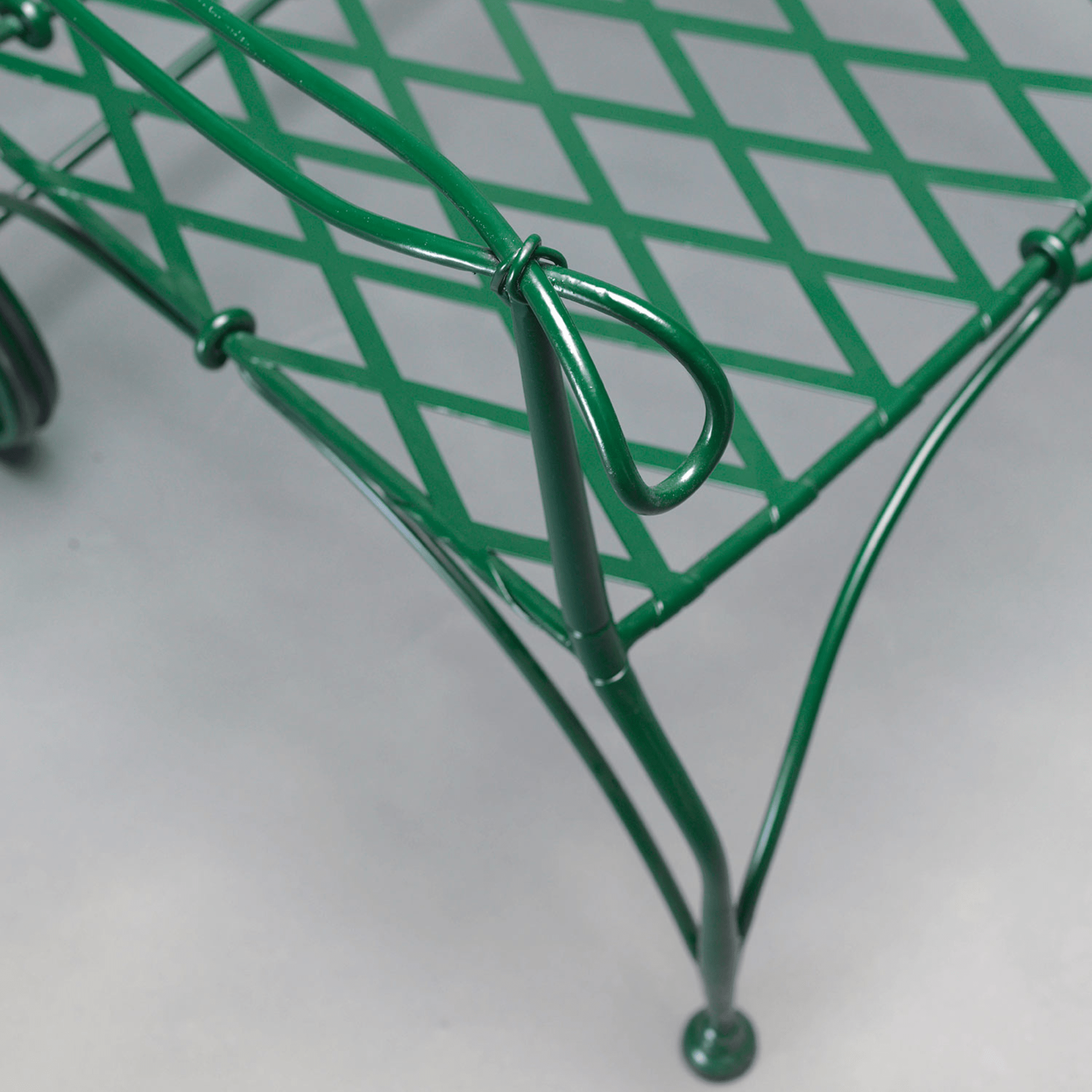 Close-up of green metal armrest and seat lattice pattern | Luxury Outdoor Armchair | Designed and Made in Italy