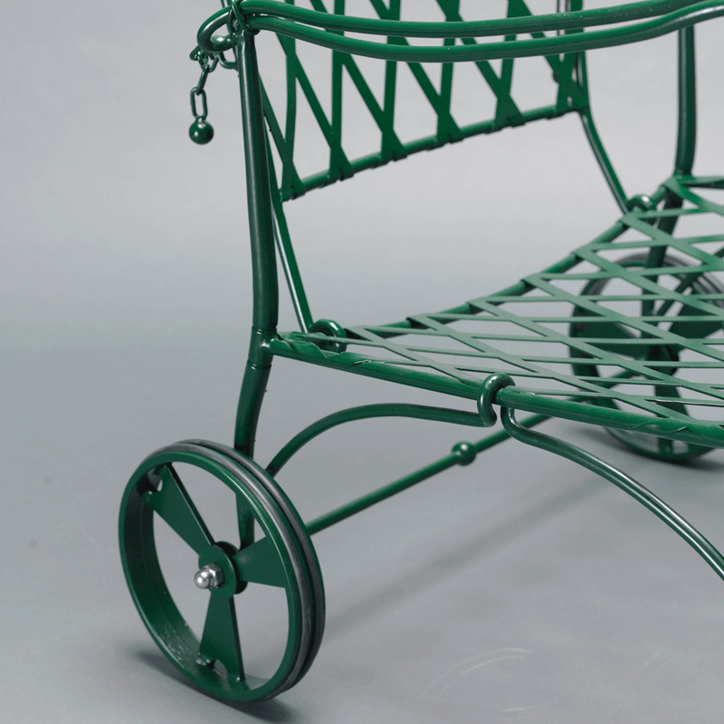 Side view of green metal outdoor armchair with wheels | High-End Garden Chair | Luxury Metal Patio Furniture