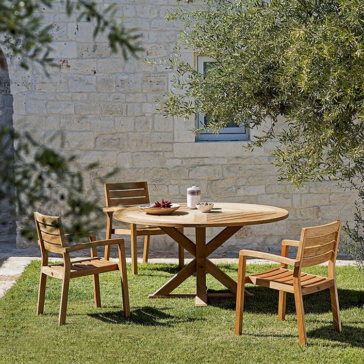 Round Teak Dining Table in a Natural Outdoor Setting | Luxury Alfresco Dining Set with Wooden Chairs | High-End Teak Patio Furniture | Designed and Made in Italy | Ethimo Cronos