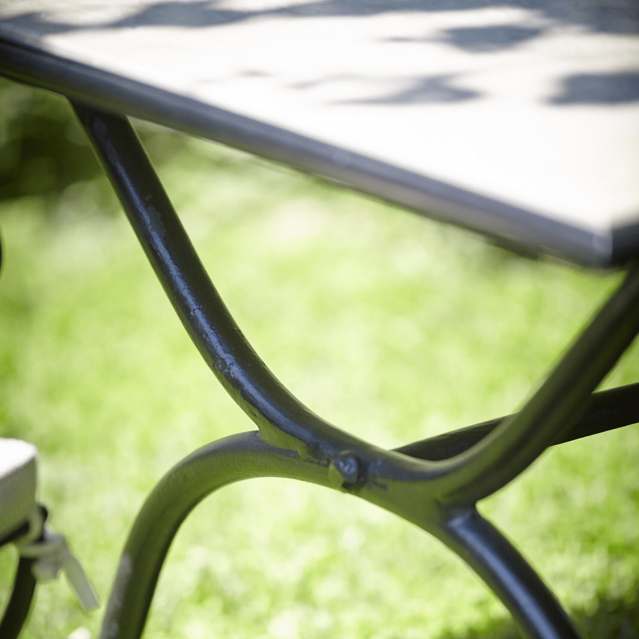 Close-up of Square Iron Outdoor Dining Table With Marble Top | Officina Ciani ROMBO | High-End Outdoor Dining Table | Luxury Metal Patio Furniture | Designed and Made in Italy